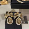 18K CC 25K Golden Bow Earrings